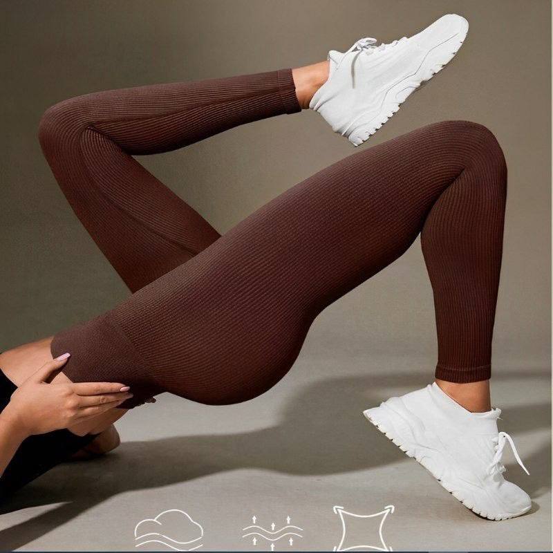 Leggings canelada de cintura larga e cor sólida para atividades esportivas.